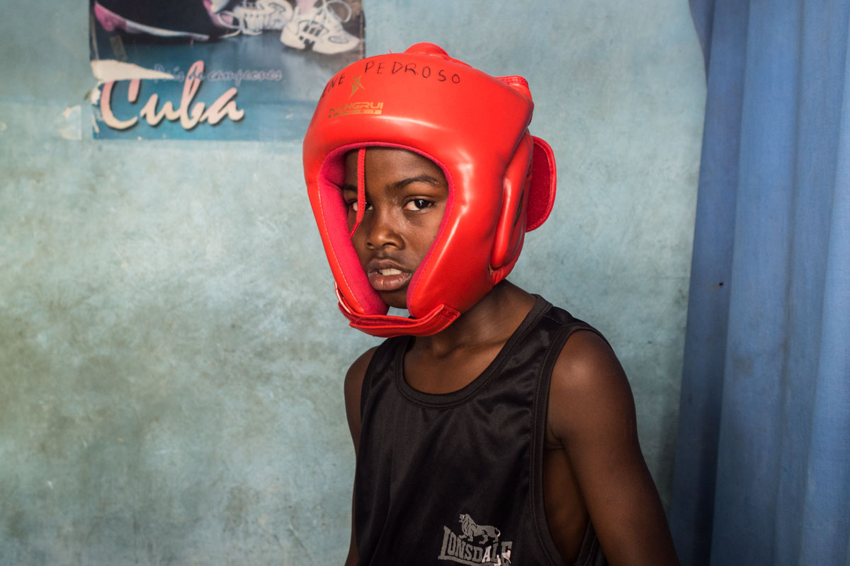 cuban photographer in a portrait session in a boxing cuban gym