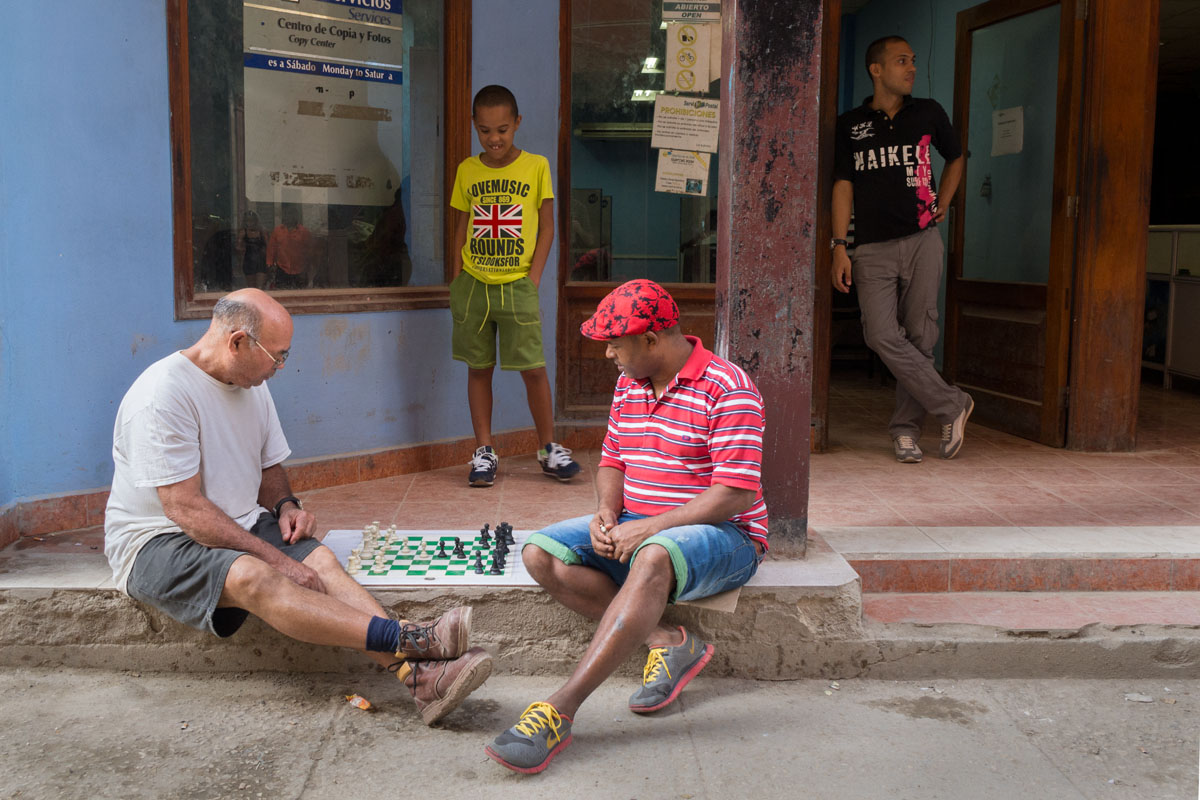 playing domino in havana, street photography focus in cuban life