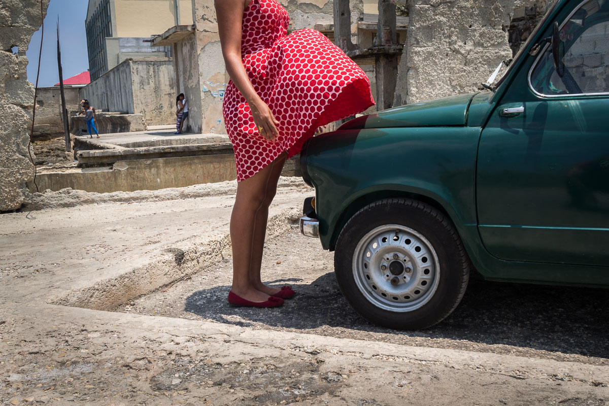 Cuban woman in front of a car in Havana photo shoot in Havana