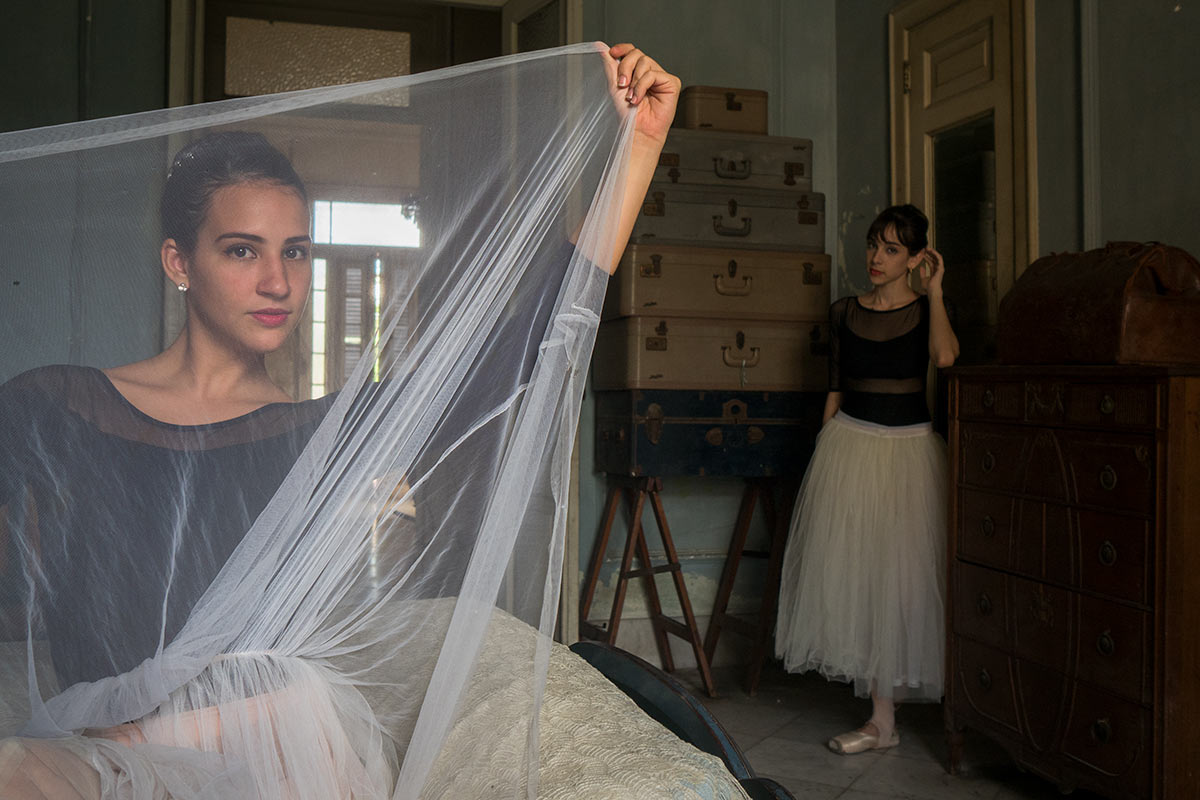 ballet dancers in colonial houses in havana , cuba