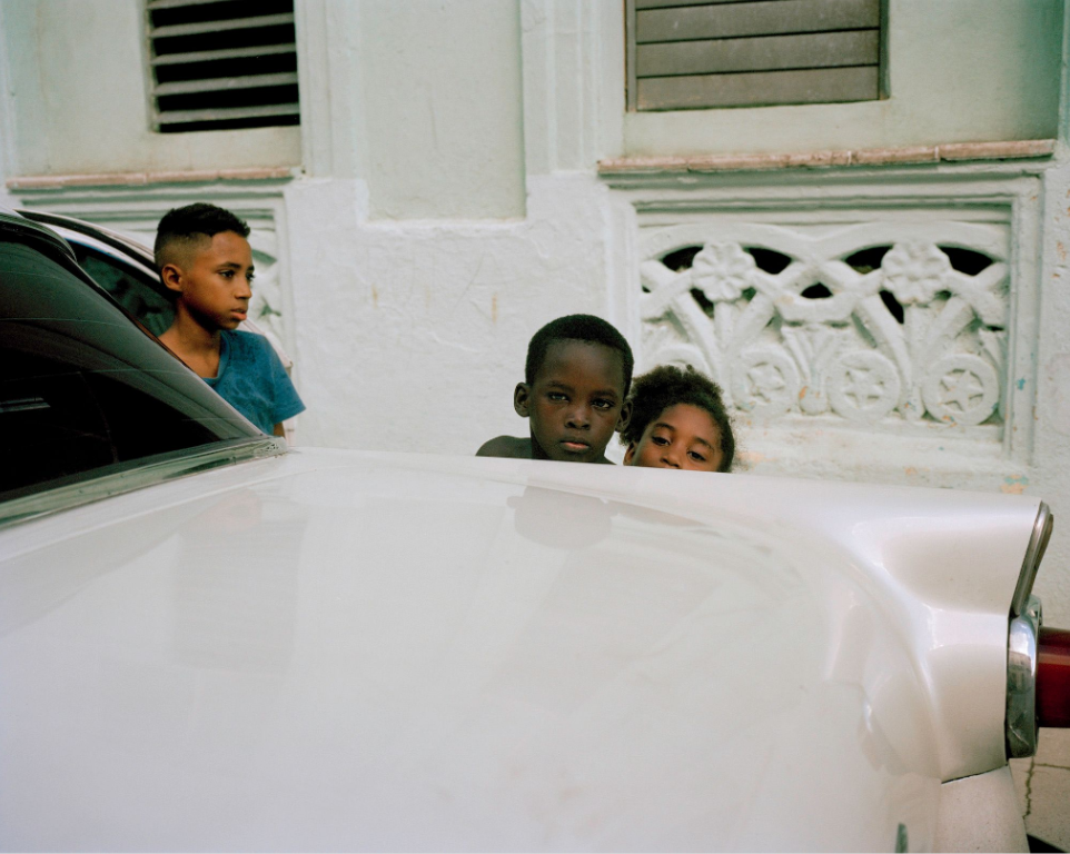 cuban boys in the street by Colby Tarsitano