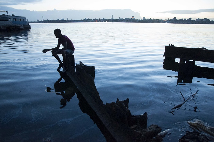 shadow of a cuban fisherman in regla 